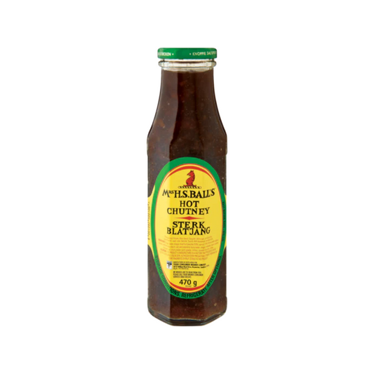 Bottle of hot chutney with a yellow label on a white background