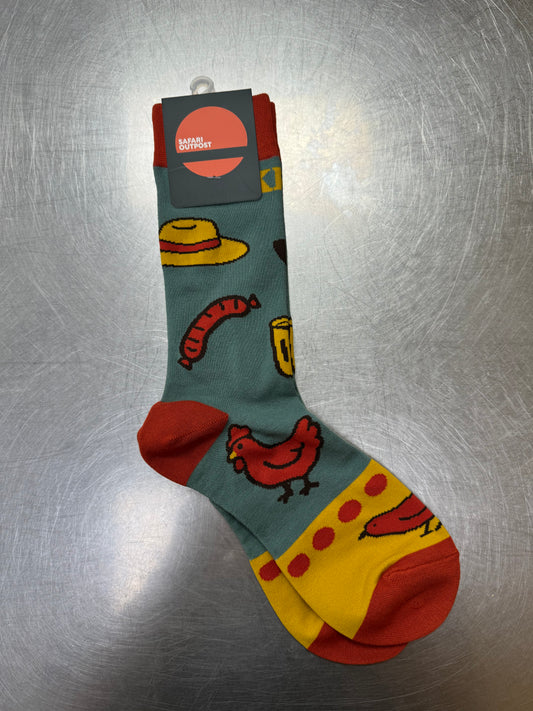 Colorful sock with cartoon designs on a metallic surface