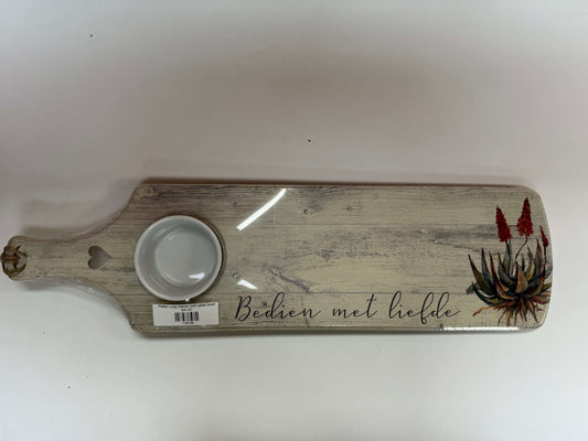Wooden serving board with a small bowl on a white background